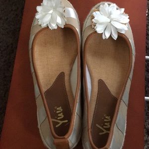Cute flats with white flower .